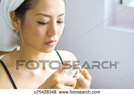Stock Photo - Young Adult, Make-Up, Cosmetics, Beauty Treatment, Therapy, Body Conscious, Body Care. Fotosearch