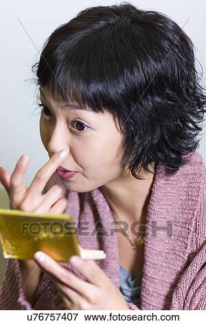 Stock Photo - Young Adult, Make-Up, Cosmetics, Beauty Treatment, Therapy, Body Conscious, Body Care. Fotosearch