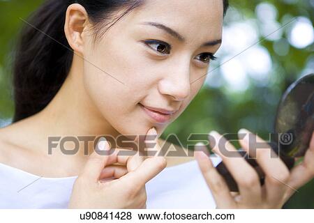 Stock Photo - Young Adult, Make-Up, Cosmetics, Beauty Treatment, Therapy, Body Conscious, Body Care. Fotosearch