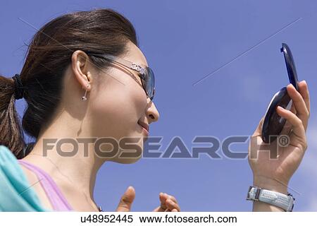 Stock Photography - Young Adult, Make-Up, Cosmetics, Beauty Treatment, Therapy, Body Conscious, Body Care. Fotosearch