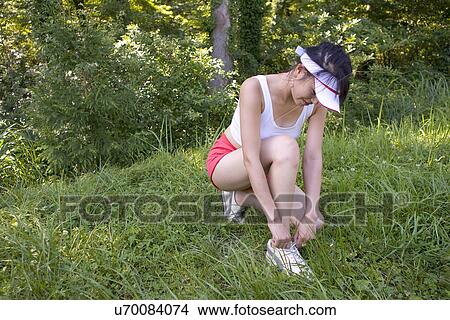 Young Adult, Young Men, Young Women, Outdoors, Sports Clothing, Athletic, Healthy Lifestyle View Large Photo Image Picture - Young Adult, Young Men, Young Women, Outdoors, Sports Clothing, Athletic, Healthy Lifestyle. Fotosearch