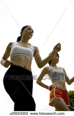 Young Adult, Young Men, Young Women, Outdoors, Sports Clothing, Athletic, Healthy Lifestyle View Large Photo Image Stock Image - Young Adult, Young Men, Young Women, Outdoors, Sports Clothing, Athletic, Healthy Lifestyle. Fotosearch