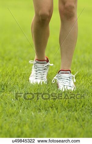Stock Image - Young Adult, Young Men, Young Women, Outdoors, Sports Clothing, Athletic, Healthy Lifestyle. Fotosearch