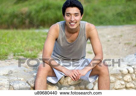 Stock Image - Young Adult, Young Men, Young Women, Outdoors, Sports Clothing, Athletic, Healthy Lifestyle. Fotosearch