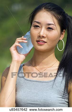 Stock Image - Young Adult, Young Men, Young Women, Outdoors, Sports Clothing, Athletic, Healthy Lifestyle. Fotosearch
