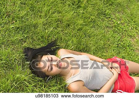Stock Image - Young Adult, Young Men, Young Women, Outdoors, Sports Clothing, Athletic, Healthy Lifestyle. Fotosearch