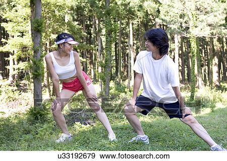 Young Adult, Young Men, Young Women, Outdoors, Sports Clothing, Athletic, Healthy Lifestyle View Large Photo Image Stock Photo - Young Adult, Young Men, Young Women, Outdoors, Sports Clothing, Athletic, Healthy Lifestyle. Fotosearch