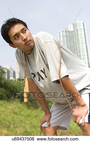 Young Adult, Young Men, Young Women, Outdoors, Sports Clothing, Athletic, Healthy Lifestyle View Large Photo Image Stock Photo - Young Adult, Young Men, Young Women, Outdoors, Sports Clothing, Athletic, Healthy Lifestyle. Fotosearch