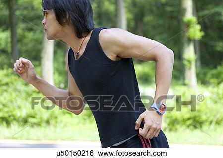 Stock Photograph - Young Adult, Young Men, Young Women, Outdoors, Sports Clothing, Athletic, Healthy Lifestyle. Fotosearch