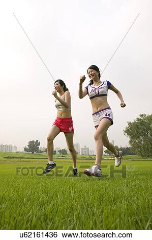 Young Adult, Young Men, Young Women, Outdoors, Sports Clothing, Athletic, Healthy Lifestyle View Large Photo Image Stock Photograph - Young Adult, Young Men, Young Women, Outdoors, Sports Clothing, Athletic, Healthy Lifestyle. Fotosearch
