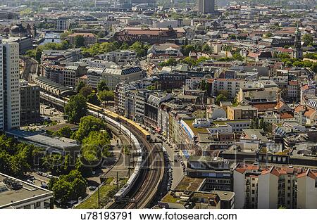 Stock Image - Aerial view from observation deck of Park Inn Hotel at Alexanderplatz to Hackerscher Markt S-Bahn station, Berlin, Germany. Fotosearch