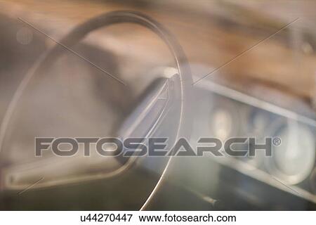 Stock Photo - Blurred view of steering wheel. Fotosearch