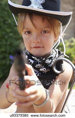 Boy in sheriff hat with gun View Large Photo Image Stock Photography - Boy in sheriff hat with gun. Fotosearch