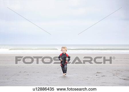 Boy running on beach View Large Photo Image Stock Photography - Boy running on beach. Fotosearch