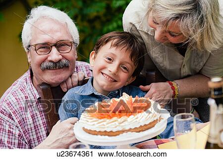 Boy with birthday cake from grandparents View Large Photo Image Stock Image - Boy with birthday cake from grandparents. Fotosearch