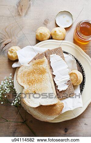 Bread, puffs and honey View Large Photo Image Stock Image - Bread, puffs and honey. Fotosearch