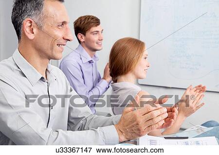 Business colleagues clapping in meeting View Large Photo Image Stock Photo - Business colleagues clapping in meeting. Fotosearch