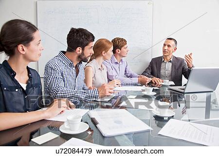 Business colleagues in meeting View Large Photo Image Stock Photo - Business colleagues in meeting. Fotosearch