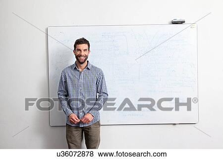 Businessman in front of whiteboard View Large Photo Image Stock Photo - Businessman in front of whiteboard. Fotosearch