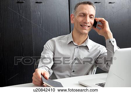 Businessman on cell phone View Large Photo Image Stock Image - Businessman on cell phone. Fotosearch