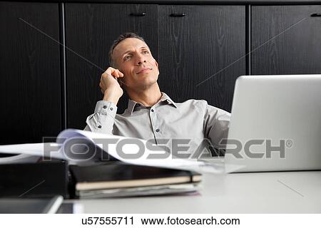 Businessman on cell phone View Large Photo Image Stock Image - Businessman on cell phone. Fotosearch