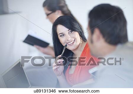 Businesspeople having conversation View Large Photo Image Stock Photograph - Businesspeople having conversation. Fotosearch
