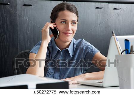 Businesswoman on smart phone View Large Photo Image Stock Photography - Businesswoman on smart phone. Fotosearch