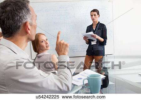 Businesswoman presenting to colleagues View Large Photo Image Stock Photography - Businesswoman presenting to colleagues. Fotosearch