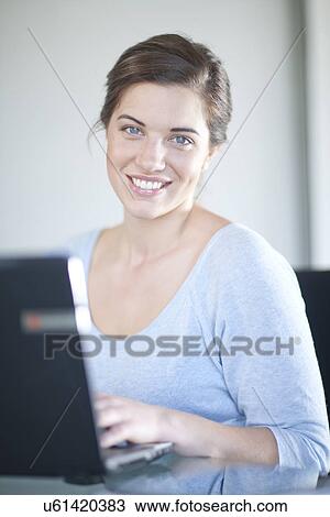 Businesswoman using laptop computer View Large Photo Image Stock Image - Businesswoman using laptop computer. Fotosearch