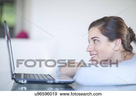 Businesswoman using laptop computer View Large Photo Image Stock Photo - Businesswoman using laptop computer. Fotosearch