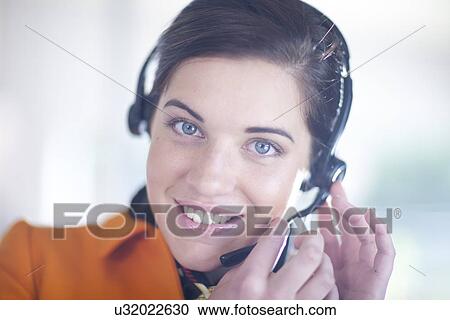Businesswoman wearing telephone headset View Large Photo Image Stock Image - Businesswoman wearing telephone headset. Fotosearch