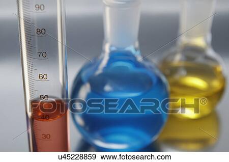 Chemical lab glassware, graduated cylinder and two flat-bottom flasks View Large Photo Image Stock Photo - Chemical lab glassware, graduated cylinder and two flat-bottom flasks. Fotosearch