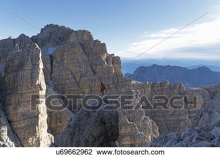 Stock Image - Climber in Brenta Dolomites, Italy. Fotosearch