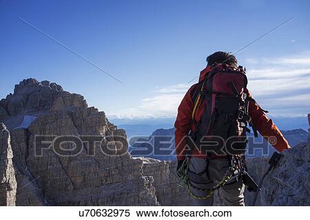 Climber in Brenta Dolomites, Italy, preparing for climb View Large Photo Image Stock Photography - Climber in Brenta Dolomites, Italy, preparing for climb. Fotosearch