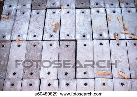 Stock Photo - Close up of metal alloy cargo in ship's hold. Fotosearch