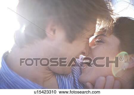 Close up of young affectionate couple View Large Photo Image Stock Image - Close up of young affectionate couple. Fotosearch
