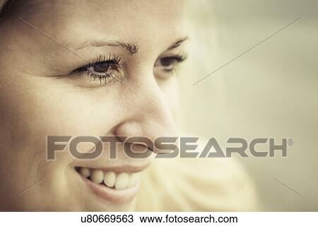 Stock Image - Close up portrait of young woman. Fotosearch