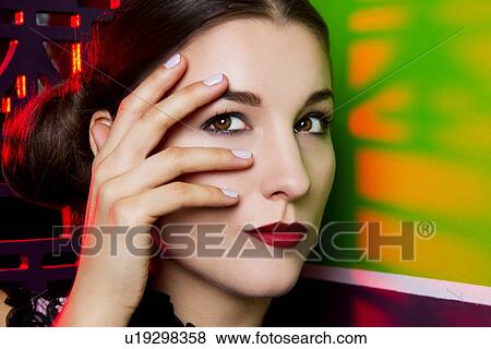 Close up portrait of young woman with hand on face View Large Photo Image Stock Photo - Close up portrait of young woman with hand on face. Fotosearch