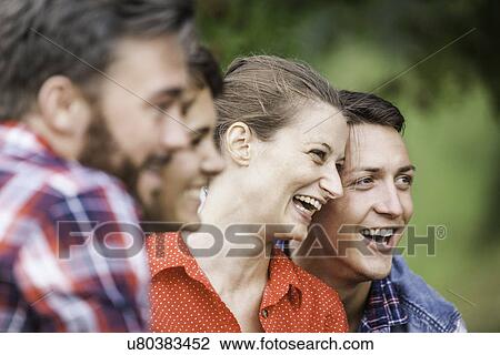 Stock Image - Close up shot of four friends smiling, Tyrol Austria. Fotosearch
