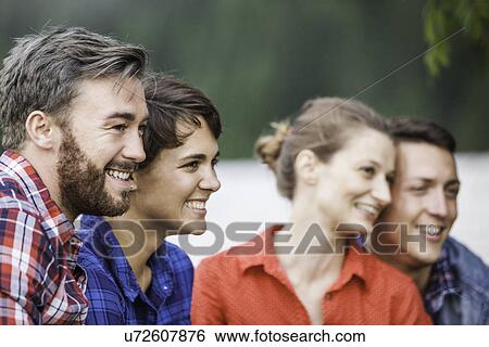 Stock Photograph - Close up shot of four friends, Tyrol Austria. Fotosearch