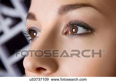 Close up studio portrait of young woman's eyes View Large Photo Image Stock Photo - Close up studio portrait of young woman's eyes. Fotosearch