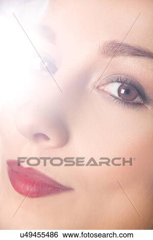 Close up studio portrait of young woman's face View Large Photo Image Stock Photograph - Close up studio portrait of young woman's face. Fotosearch