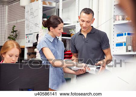 Colleagues in office View Large Photo Image Stock Image - Colleagues in office. Fotosearch
