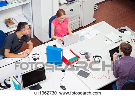 Colleagues working in office, high angle View Large Photo Image Stock Image - Colleagues working in office, high angle. Fotosearch