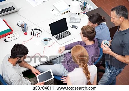 Colleagues working in office, high angle View Large Photo Image Stock Image - Colleagues working in office, high angle. Fotosearch