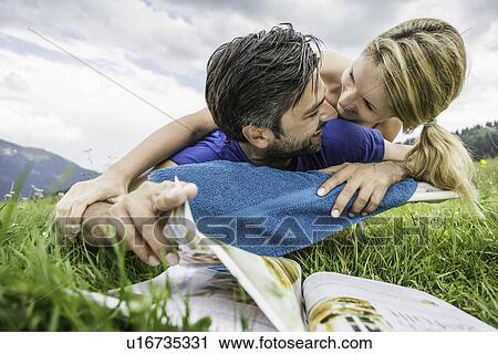 Stock Image - Couple enjoying the meadow. Fotosearch