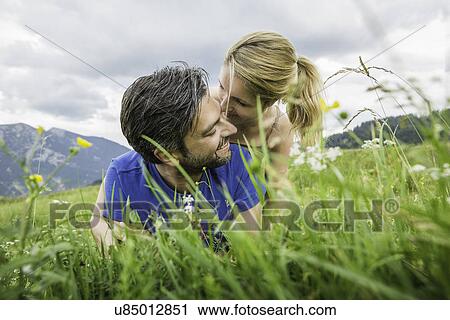 Stock Image - Couple enjoying the meadow. Fotosearch