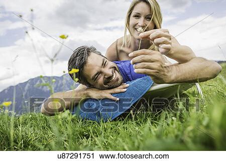 Stock Image - Couple enjoying the meadow. Fotosearch