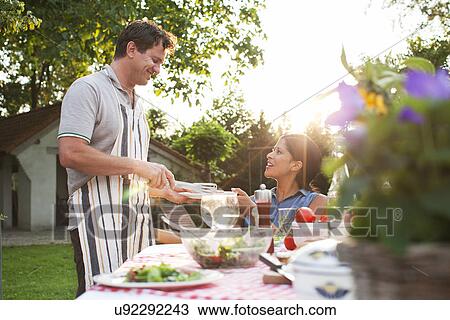 Couple having dinner in garden View Large Photo Image Stock Image - Couple having dinner in garden. Fotosearch