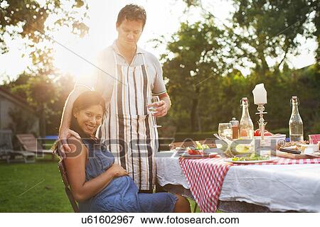 Couple having dinner in garden View Large Photo Image Stock Photo - Couple having dinner in garden. Fotosearch